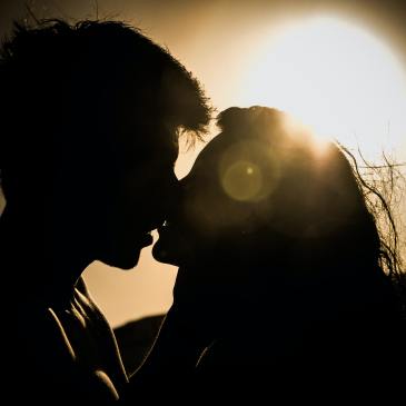 Sunset silhouette kiss