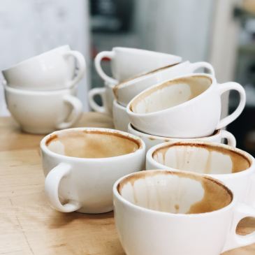empty white coffee mugs on a table